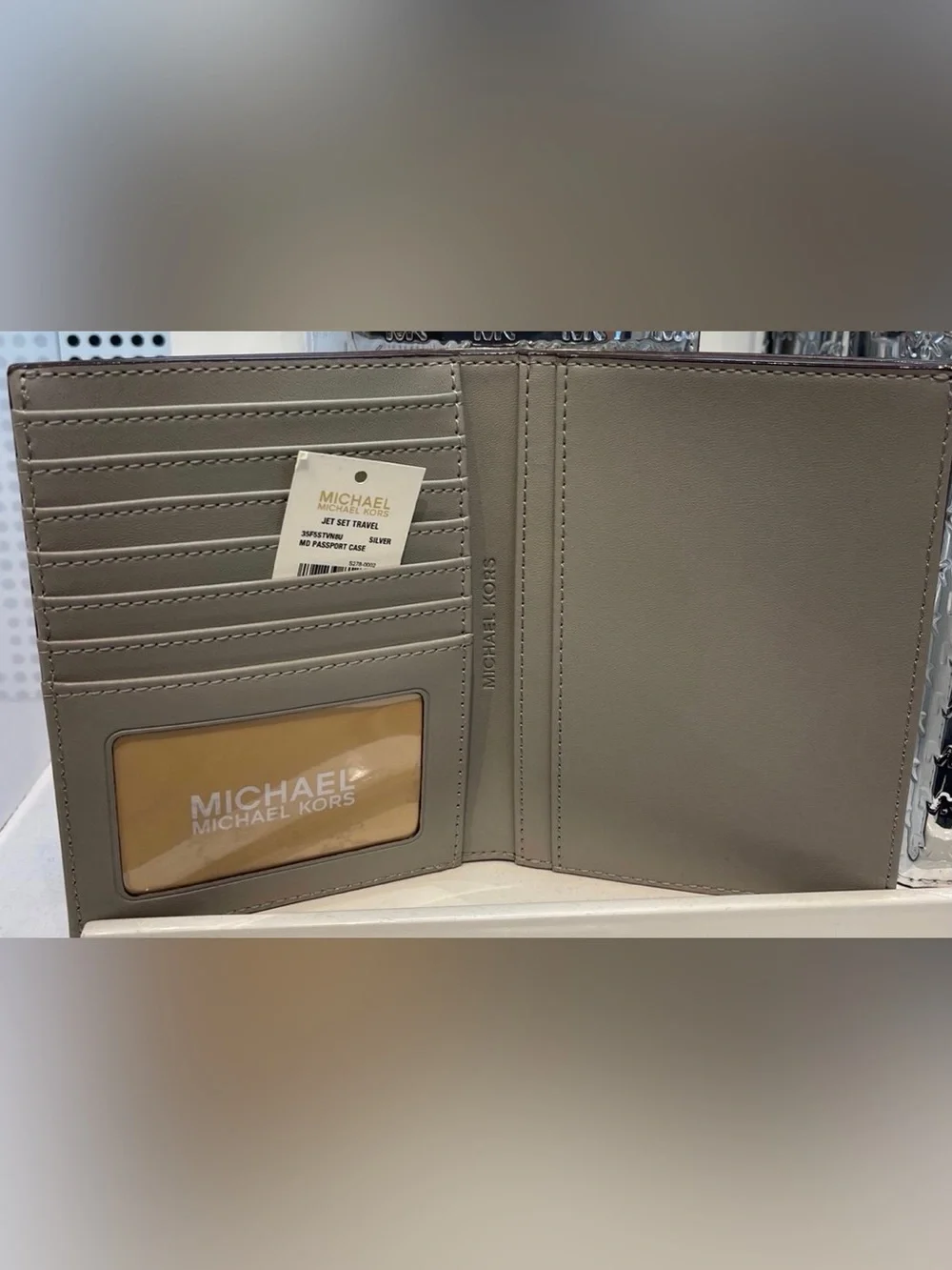 Michael Kors Metallic Silver Embossed MK Passport Cover